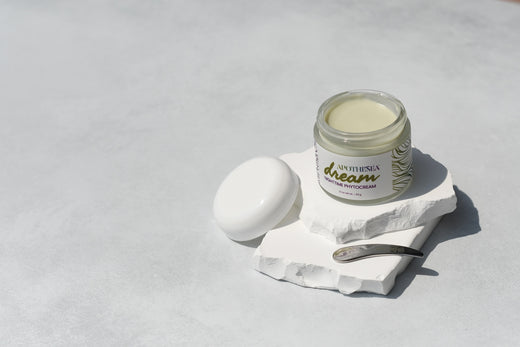 Apothesea Dream Nighttime Phytocrem on white stone with scoop